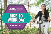 Business woman on bike. Text reads Bike to Work Day May 21, 2021