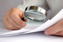 magnifying glass and document