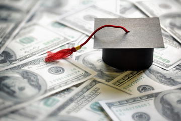 graduation cap and cash