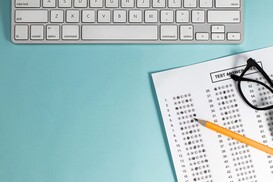 exam laptop glasses pencil answer sheet