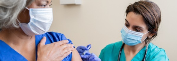 Nurse-gives-senior-covid19-vaccination-banner-image