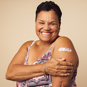 woman with flu shot band aid