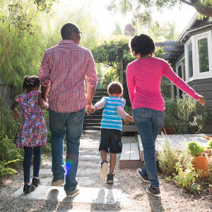 Family walking together outside of house