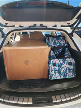 A white SUV full of toy drive donations