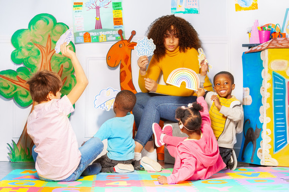 children with teacher at daycare