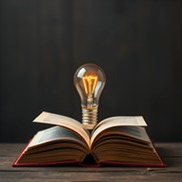 Open book with a lighbulb 