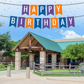 Summerglen Library building with Happy Birthday banner