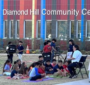 Kids reading outdoors