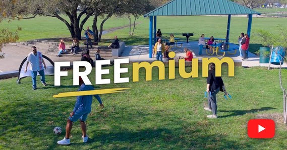 Freemium video still of people at a park doing outdoor activities