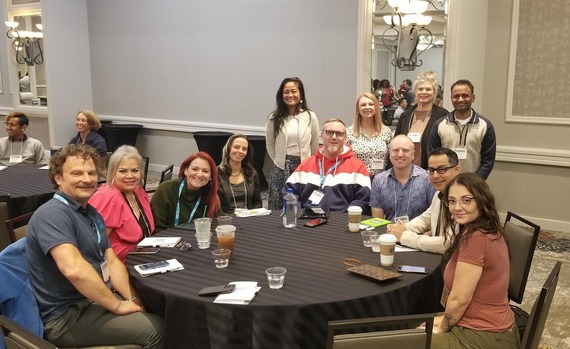 Group of people sitting at table at the Texas HIV STI Conference 2024