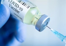 COVID-19 vaccine and syringe 