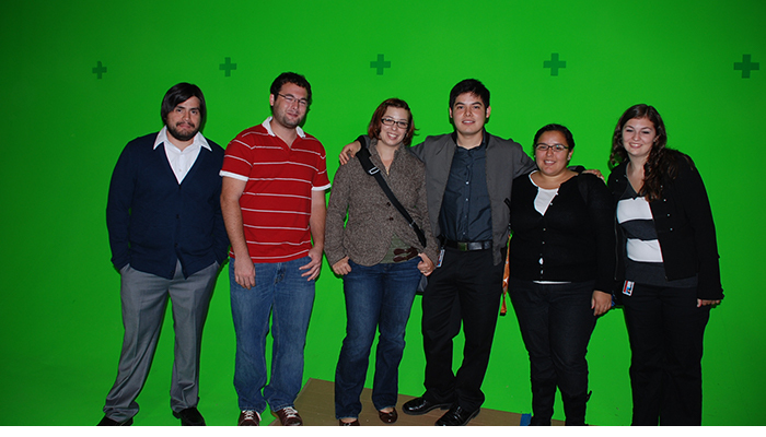 TFC Interns on studio tour in front of green screen