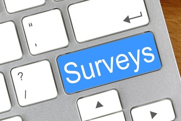 "Surveys" written on a keyboard key