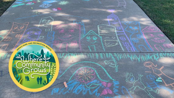 Chalk drawings on sidewalk to promote a Chalk Your Park event