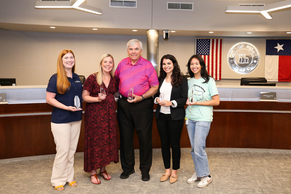 image of marketing & communications team presented awards at council meeting