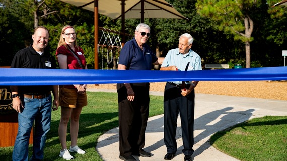 Mayor, Councilmembers, and Park Board members cutting ribbon to open Rickel Park Playground