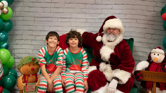 Photo of children with Santa at the Sensory Friendly Breakfast with Santa event