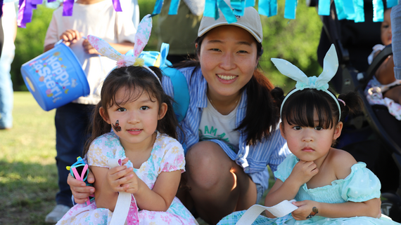 Photo at the 2025 Eggstravaganza of a family at the Egg Hunt