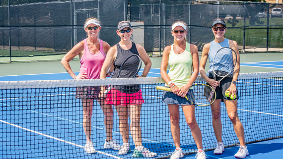 Ladies standing and smiling at the Hurst Tennis & Pickleball Center