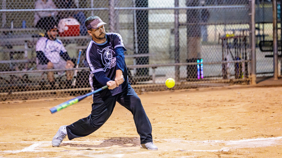 Man playing softball at Hurst Athletic Complex