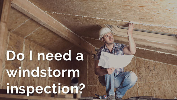 Windstorm inspector looking at the inside of a roof