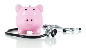 piggy bank with stethoscope