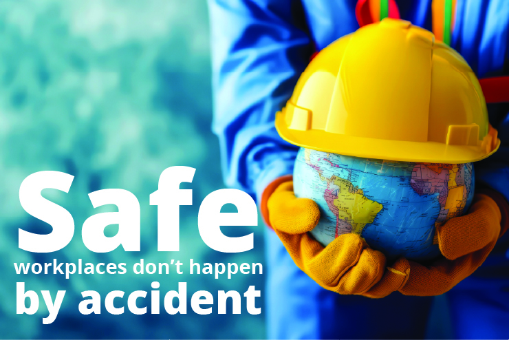 The words, "Safe workplaces don't happen by accident," are beside a worker wearing gloves and coveralls holding a globe topped with at hard hat.