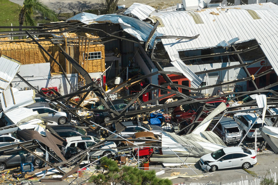 Twisted metal and debris at a business location from a tornado.