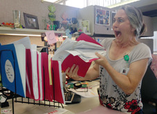 Administrative Assistant A. Wertz with file folders