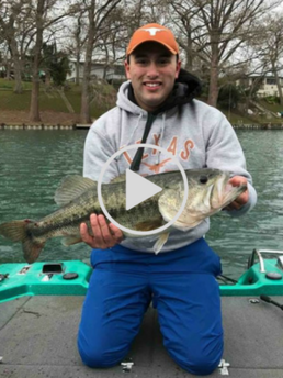 man holding large bass, link to video of first catch of the year
