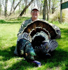 hunter holding tom turkey