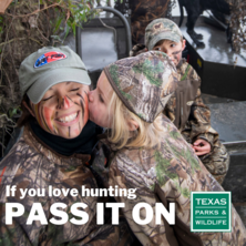Mother and daughter in camo hugging