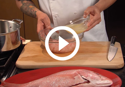 pouring lemon juice over fish to make ceviche, video link
