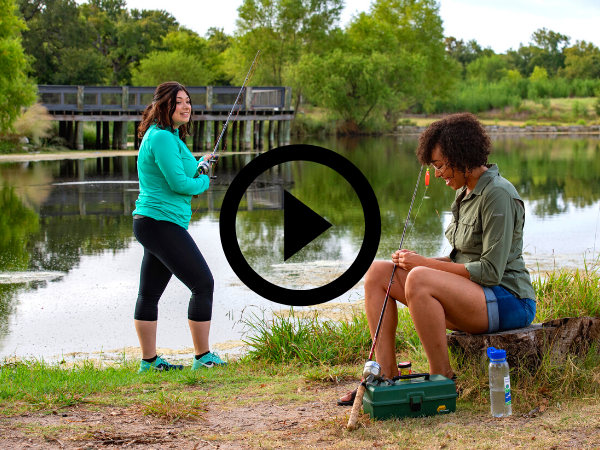 two women fishing and laughing