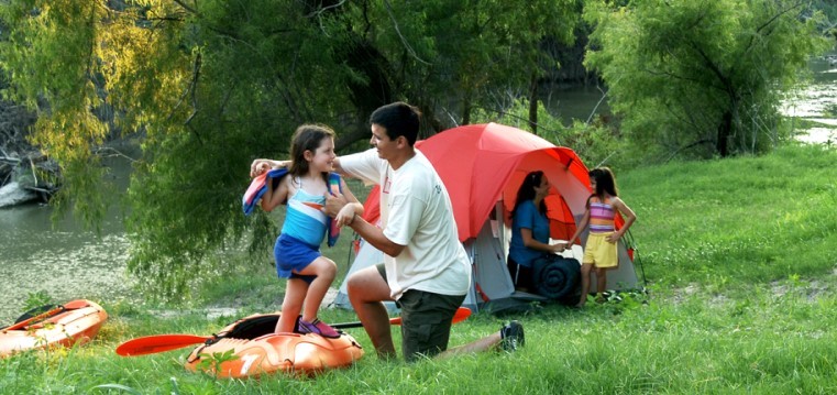 Family of paddlers camping