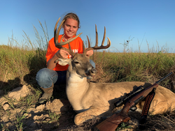 girl with harvested buck