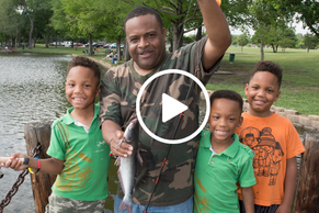 man with triplets holding catfish, video link