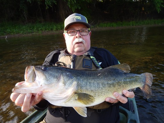 Picture of Jerry holding a large bass