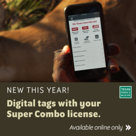 A hunter holding a smart phone showing the My Texas Hunt Harvest app