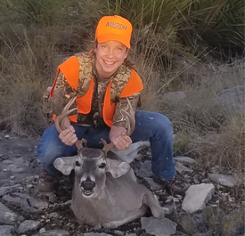 young hunter with buck harvest
