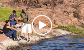 Family fishing on the rock shore of Inks Lake, video link