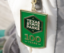 100 Years of State Parks keychain on backpack