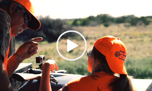 volunteer and child on youth hunt, video link