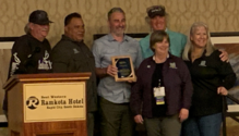 Picture of angler ed staff and volunteers accepting award