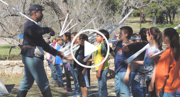 Buffalo soldier demonstrating marching to kids, video link 