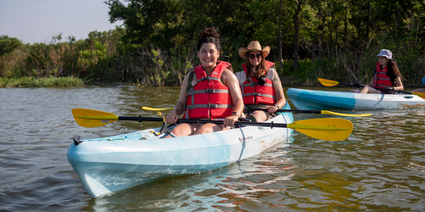 Image of two women in a kayak together.