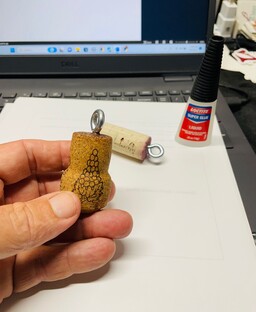 Picture of an eye bolt glued into a cork