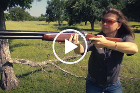 Woman with shotgun, video link