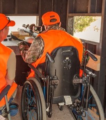 Hunter in wheelchair wearing blaze orange 
