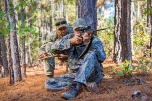 Hunter takes aim in forest